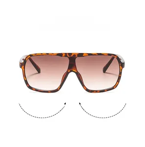 Detail of tortoise shell oversized sunglasses with gradient brown lenses and metal joints