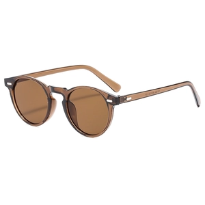 Retro-Sonnenbrille mit rundem Bernsteinrahmen, UV-Schutz und silbernen Nietendetails