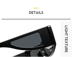 Detail of black sunglasses featuring a wide hollow temple design and smooth glossy finish