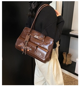Brown vintage large tote bag with multi-pockets and a cute dog pendant on the shoulder