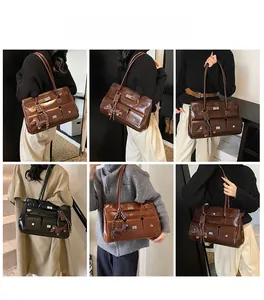 Detailed look at retro glossy shoulder bags in black and brown with front pockets