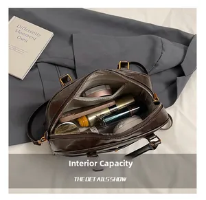 Deep brown leather tote bag interior showing spacious capacity for cosmetics and phone