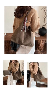 Brown suede tote bag detail featuring plush bear charm and ribbon for autumn style
