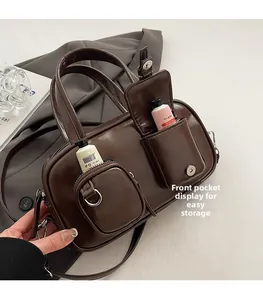 Detail view of coffee brown PU leather bowling bag with functional front pockets and zipper