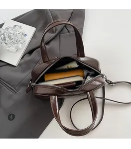 Top view of large brown crossbody bag showing spacious interior with daily essentials