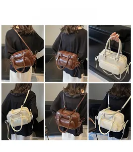 Retro Boston bag shown in dark brown and beige with multiple carrying style views