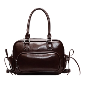 Mochila vintage de cuero marrón con gran capacidad y elegantes lazos laterales