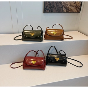 Glossy flap shoulder bags in four colors with triangle metal buckles on elegant display