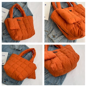 Detailed views of bright orange quilted puffer tote bag with matching mini coin purse