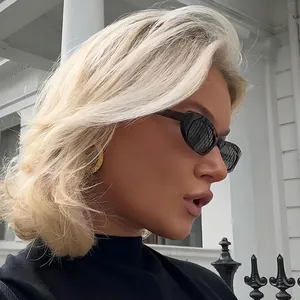 Retro small frame sunglasses for women with metal hinges and dark grey lenses