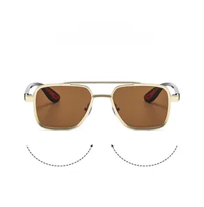 Detail view of gold metal double bridge frame and tinted brown lenses for men