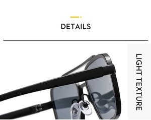 Detail of glossy black aviator sunglasses frame featuring soft silicone nose pads