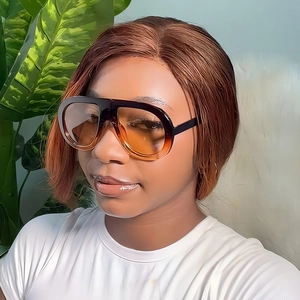 Fashionable oversized aviator sunglasses with gradient frames on a female model
