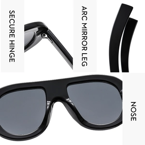 Detail view of secure hinges, ergonomic arc legs, and integrated nose pads on black sunglasses