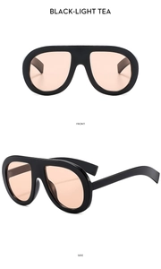 Front and side view of black oversize sunglasses with light tea lenses and thick temples