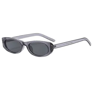 Retro oval sunglasses with gray transparent frames and dark lenses in 45-degree view