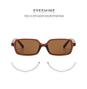 Close-up of retro square sunglasses featuring translucent amber frames and integrated nose pads
