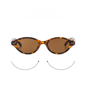 Close-up of tortoise shell cat eye sunglasses with brown lenses and silver rivet details