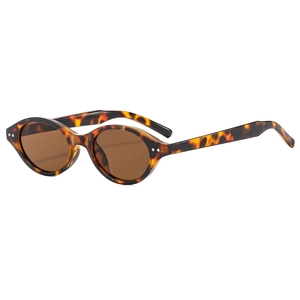 Retro tortoise shell oval sunglasses with brown lenses and metal rivet detail