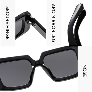 Detail view of black square sunglasses featuring secure hinges and comfortable nose pads