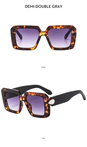 Detail of tortoise shell square sunglasses with gradient purple lenses and teardrop decor