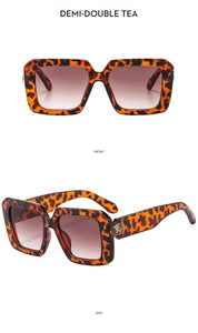 Front and side view of oversized tortoiseshell sunglasses with brown gradient lenses