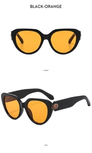 Detailed front and side view of cat eye sunglasses with black frame and orange lenses