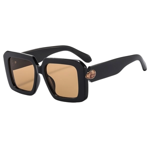 Chic black oversized square sunglasses with brown lenses and amber droplet accents