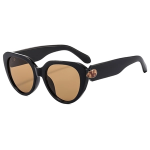 Women's cat eye sunglasses with black frames, brown lenses and gold droplet accents
