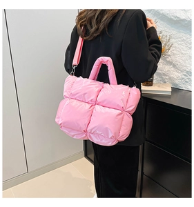 Quilted puffer tote bag in pink with wide nylon strap and glossy waterproof finish