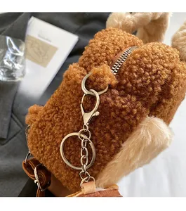 Close-up of teddy plush shoulder bag with premium gold zipper and metal hardware