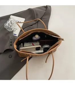 Detailed interior of a caramel tote bag showing large capacity for essentials