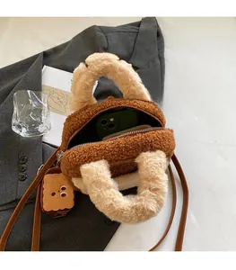 Detail view of plush crossbody bag interior showing spacious capacity for smartphones