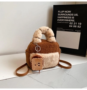 Close-up of plush fleece bowling bag with cute toast-shaped coin purse and brown strap