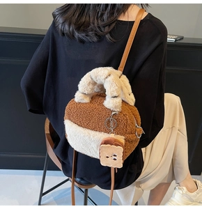 Detailed view of plush lamb wool mini backpack with toast pendant and slim leather straps