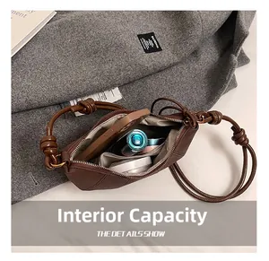 Internal capacity of dark brown matte leather hobo bag showing organized essentials