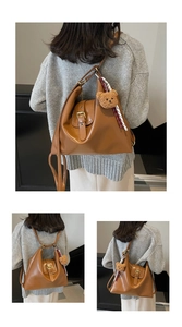 Detail view of brown vintage leather tote backpack with a cute plush bear charm accessory