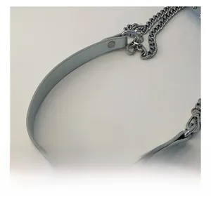 Detail of adjustable PU leather and silver metal chain shoulder strap for handbags