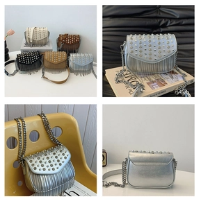 Detail view of rhinestone fringe crossbody bag with studded flap and punk style metallic chains