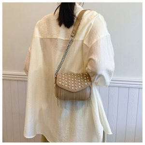 Detail of khaki PU leather crossbody bag with rhinestone flap and metal fringe tassels