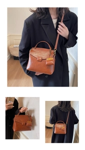 Detail view of vintage brown crossbody bag with mini pouch and adjustable strap