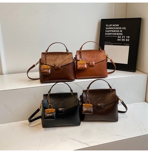 Detailed close-up of retro leather textured shoulder bags in four vintage colors