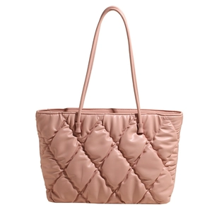 Pink quilted tote bag with diamond pattern and slim shoulder straps for daily commute