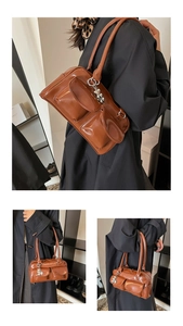 Close-up of caramel brown shoulder bag featuring multi-pocket design and silver metal charms