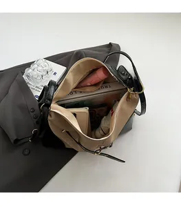 Macro view of the spacious inner compartment with books and a smartphone inside