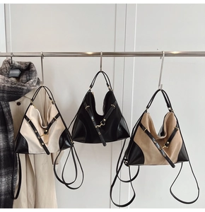 Detailed display of large capacity patchwork handbags in various neutral color combinations