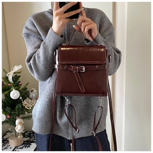 Deep wine red retro square bag with leather strap and buckle detail for daily commute