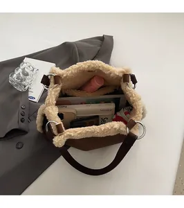 Brown fleece shoulder bag interior view showing large storage for tablet and wallet