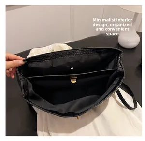 Interior view of crocodile pattern tote bag showing multiple compartments and zipper pockets