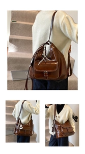 Nahaufnahme der braunen Vintage-Leder-Tote-Bag mit Schnallentasche und Web-Anhänger